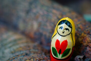 Matryoshka on a wooden background. Background image.