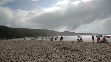 people walking on the beach