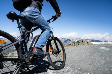 Naklejka premium Man Riding Electric Mountain Bike