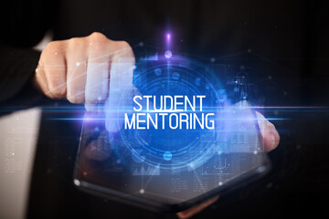 Young man holding a foldable smartphone with STUDENT MENTORING inscription, educational concept