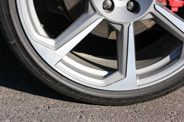 close up of a very low profile sports car tire