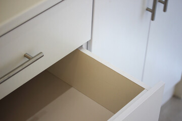 Empty drawer in a new cupboard - obrazy, fototapety, plakaty
