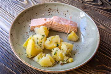 Plate of salmon with boiled potatoes