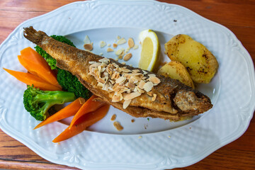 Plate of trout with salad