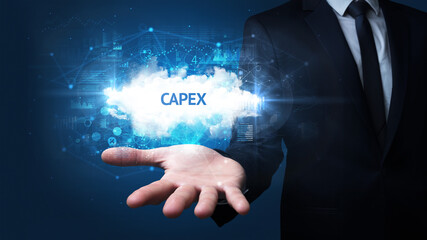 Hand of Businessman holding CAPEX inscription, successful business concept