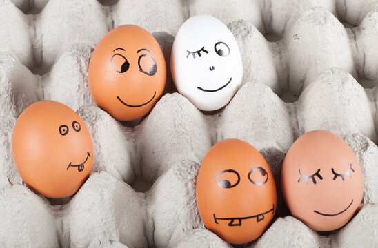 group of funny smiling eggs in a packet