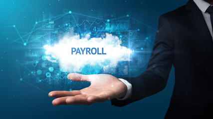 Hand of Businessman holding PAYROLL inscription, successful business concept