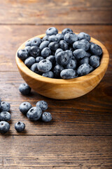 Blueberries and strawberries are prepared for breakfast.