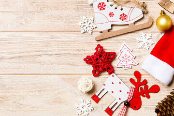 Top view of Christmas decorations and toys on wooden background. Copy space. Empty place for your design. New Year concept