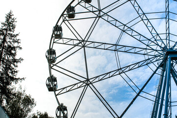 Ferris wheel in an amusement park. Outdoor entertainment.