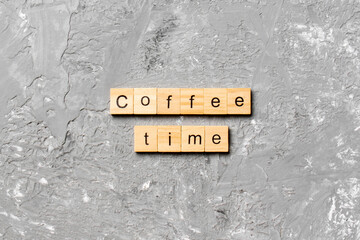 coffee time word written on wood block. coffee time text on cement table for your desing, concept