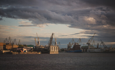 Fototapeta na wymiar Shipyards at sunset in autumn.Shipbuilding in Russia.