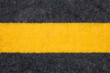 Yellow lines on asphalt