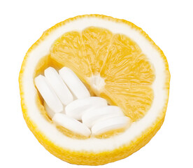 Close up of lemon and pills isolated - vitamin concept