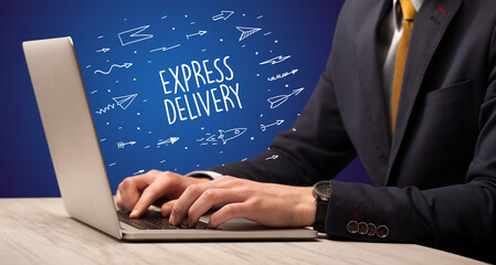 Businessman working on laptop with EXPRESS DELIVERY inscription, online shopping concept