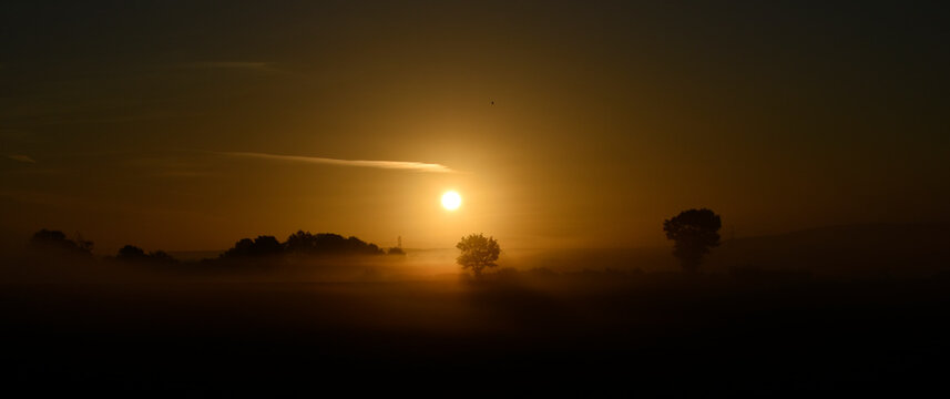 September misty orange and sepia sunrise in Buckinghamshire UK. 