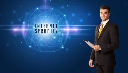 Businessman thinking about security solutions with INTERNET SECURITY inscription