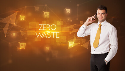 Businessman with shopping cart icons and ZERO WASTE inscription, online shopping concept