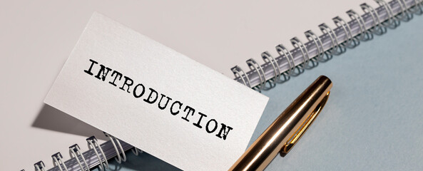 Word INTRODUCTION on paper on office desk