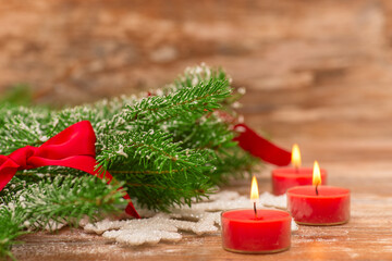 Christmas fir tree with decoration on a wooden