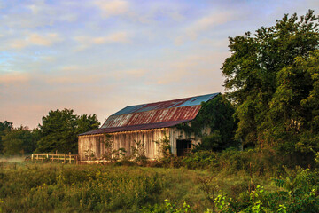 old abandoned barn at sunrise