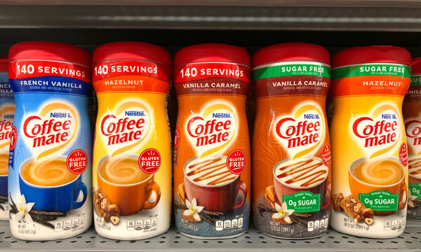 San Leandro, CA - Sept 4, 2020: Grocery store shelf with containers of Nestle brand Coffee mate creamers in various flavors. With sugar and sugar free.