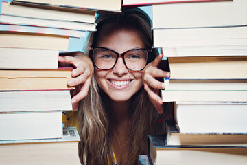 Young beautiful woman happy with books