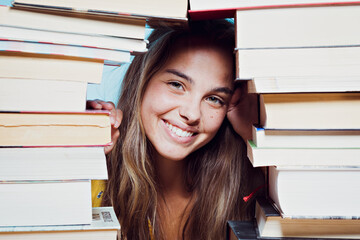 Young beautiful woman happy with books
