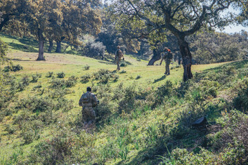 Soldiers in a combat situation. Men play airsoft.