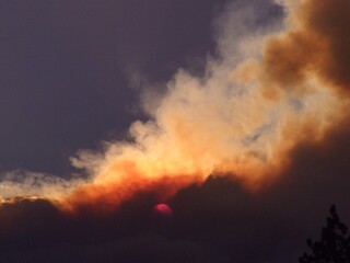 Obraz na płótnie Canvas fire and smoke with the red sun 