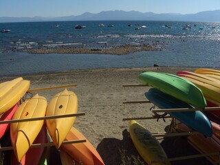 colorful kayaks on the beach in Lake Tahoe, CA, USA
