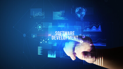 Hand touching SOFTWARE DEVELOPMENT inscription, new business technology concept