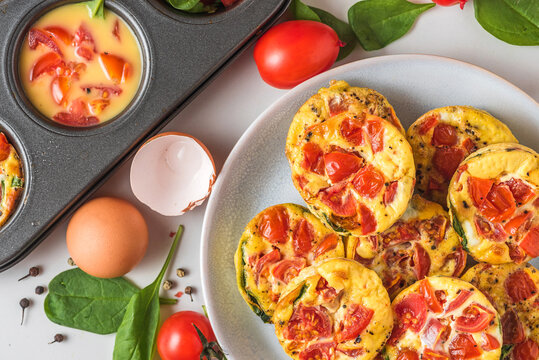 Keto Or Low Carb Diet Breakfast. Egg Cups Or Omelet With Spinach And Tomatoes In A Plate And Muffin Cups