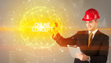 Handsome businessman with helmet drawing ONLINE CONCEPT inscription, social construction concept