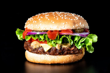 Delicious cheeseburger with beef cutlet, lettuce, tomato slices, red onion and sesame seed bun.