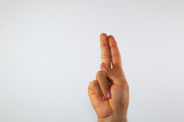 close up of a man's hand communicating with sign language, letters of the alphabet, on a white background