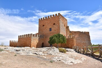 Peñarroya Castle next to the reservoir.