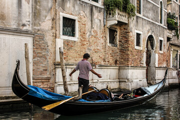 Fototapeta na wymiar Gondola in Venice with guy singing to passengers