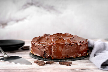 Chocolate vegan cake on gray rustick backround