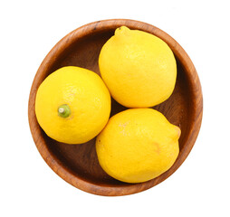 Yellow ripe lemons isolated in wooden bowl on white background