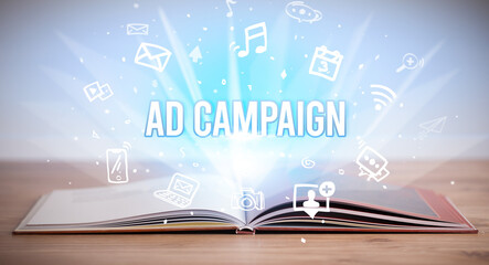 Opeen book with AD CAMPAIGN inscription, business concept
