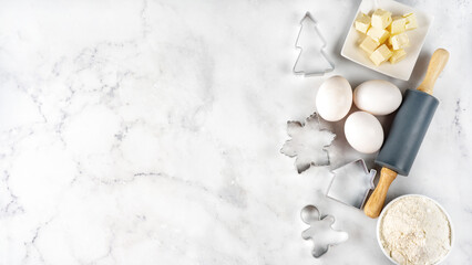 Top view of Christmas baking white background with ingredients