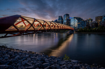 View of pedestrian bridge over the Bow River in Calgary Alberta at sunrise. 