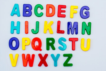Colored letters in English on a white background