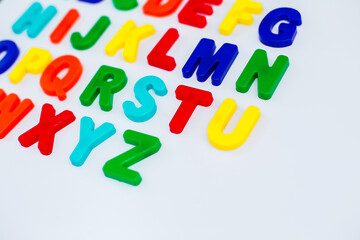 Colored letters in English on a white background