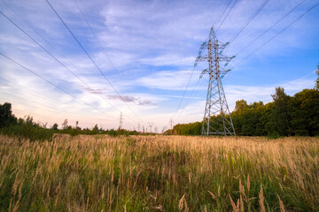 Power line supports at the beautiful sky background. Power supply concept