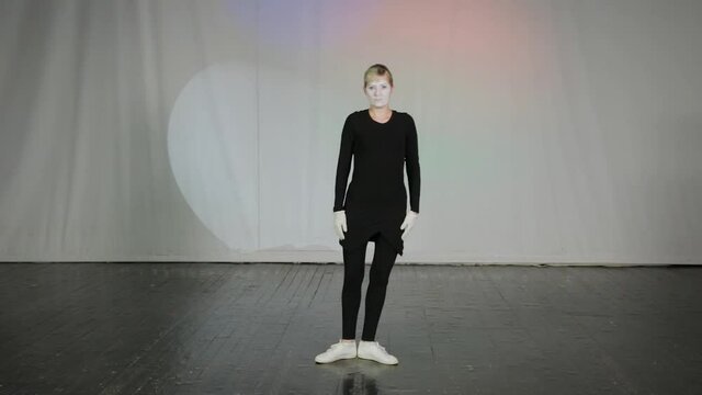 Woman mime on stage of pantomime theater.