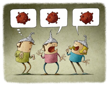 three people with an aluminum foil cap on their heads talk about conspiracies.