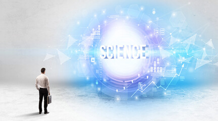 Rear view of a businessman standing in front of SCIENCE inscription, modern technology concept