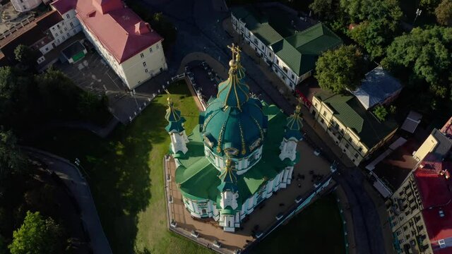 Orthodox Church on green hill in the city Kyiv, Ukraine. Aerial View of St. Andrews Church in the morning